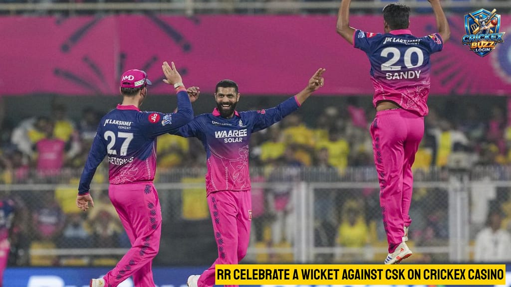 Rajasthan Royals players, wearing pink and purple, celebrate the early wicket of CSK batsman in Guwahati, tracked live on crickex casino.